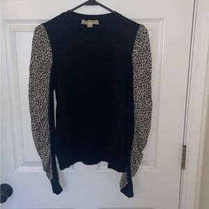 Michael Kors black sweater with ruffled leopard print sleeves. Great condition